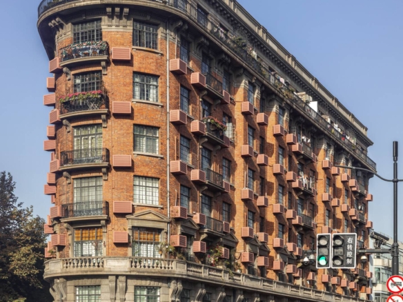 Rare south-facing 1-bed at the Wukang Building. 90 sqm, balcony facing the Soong Ching-ling residence, original fireplace and teak floors, central AC. 28,000 RMB/month.