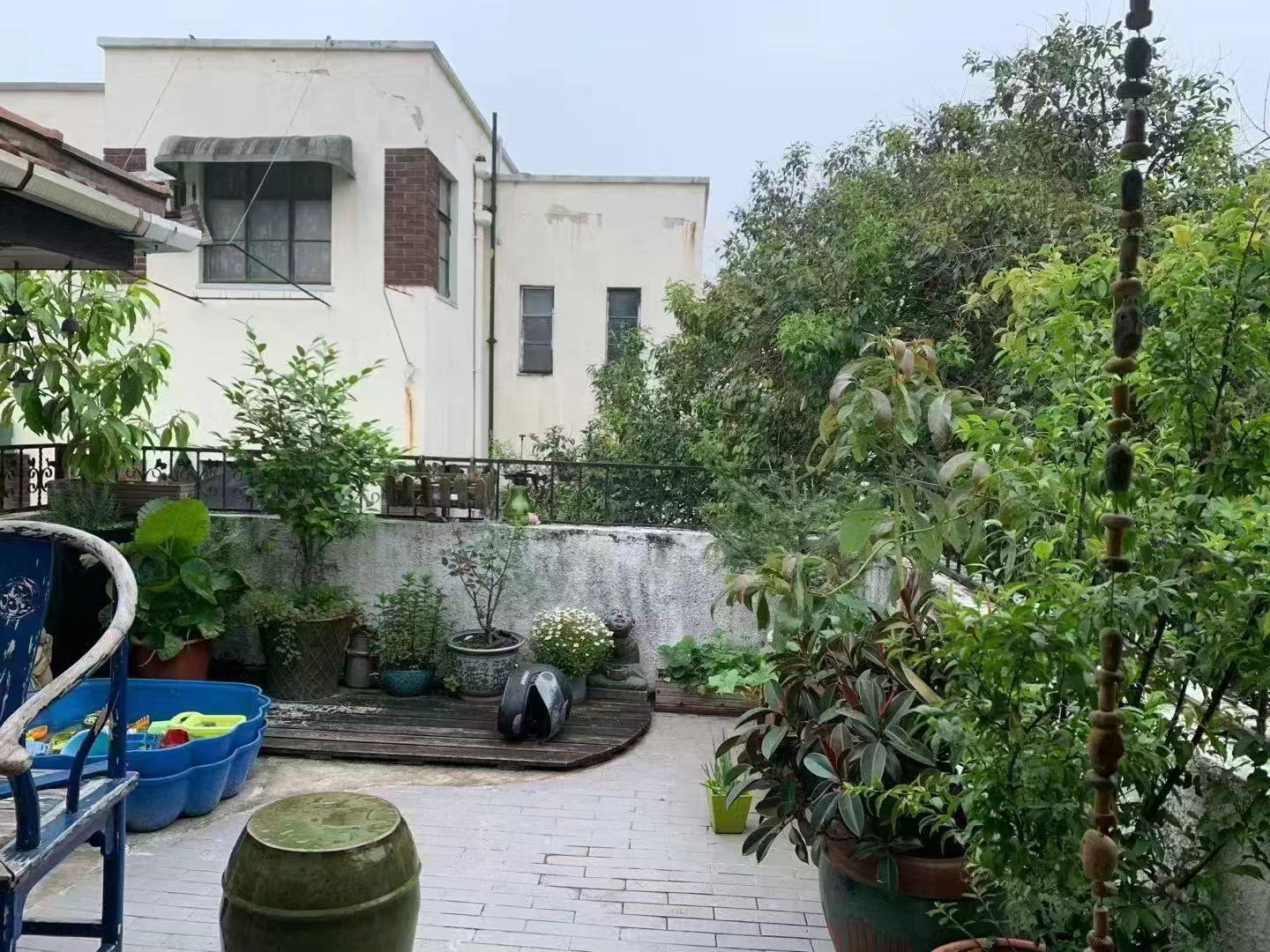 Entire 3rd floor lane house at Lane 245, Wuyi Road. 2+1 beds, 1 bath, 125 sqm, terrace, wall heating. Near Jiangsu Road Station. 16,500 RMB/month.