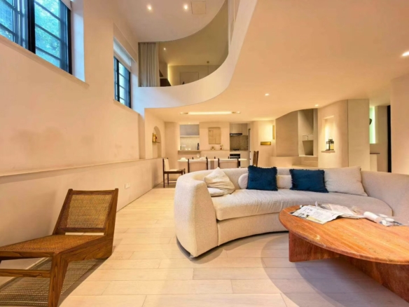 2-bed, 2-bath heritage lane house apartment at Lane 63, Xingguo Road. 150 sqm, central AC, floor heating, near Jiaotong University Station. 20,000 RMB/month.
