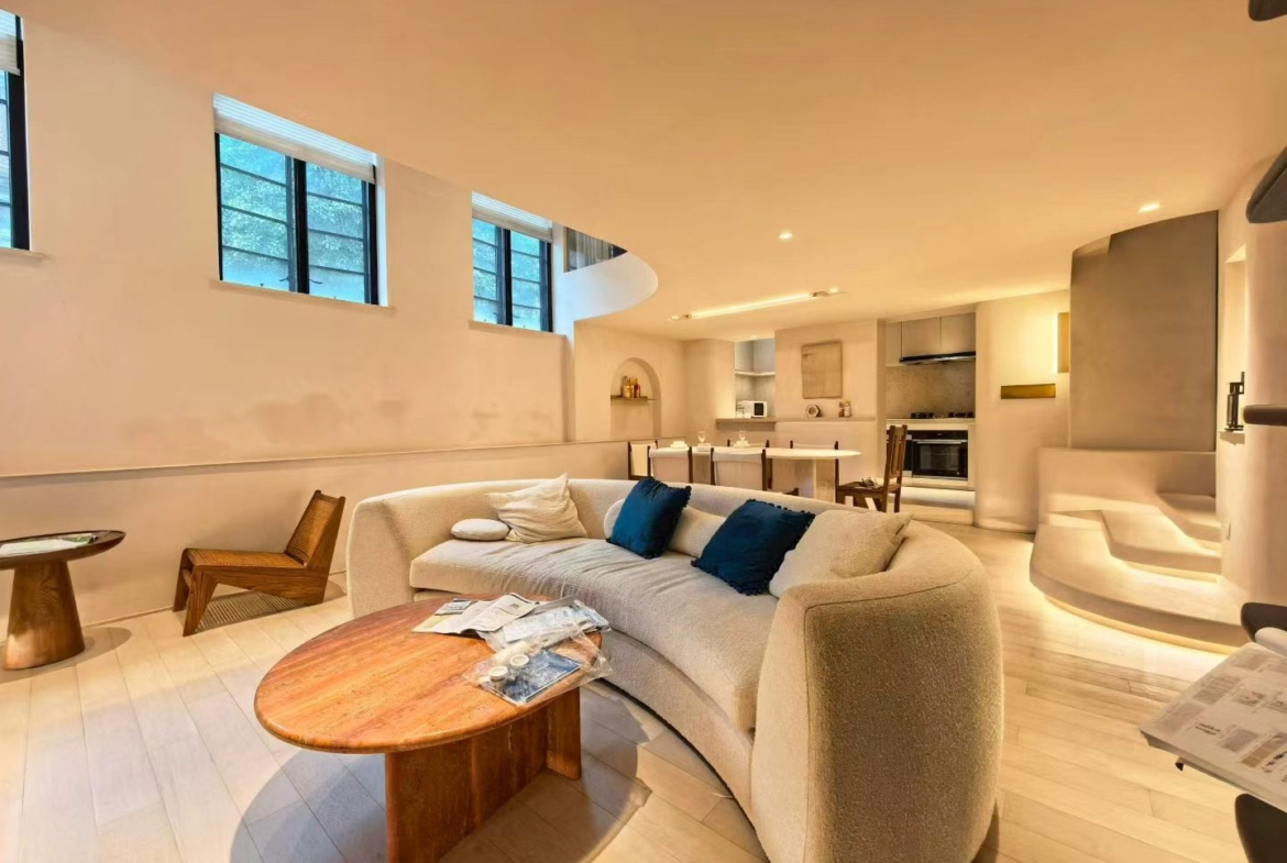 2-bed, 2-bath heritage lane house apartment at Lane 63, Xingguo Road. 150 sqm, central AC, floor heating, near Jiaotong University Station. 20,000 RMB/month.